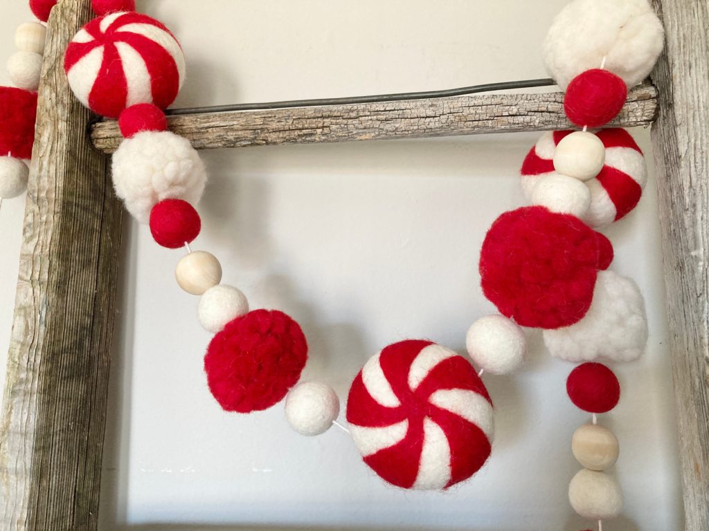 garland of felt red and white balls and felt peppermints