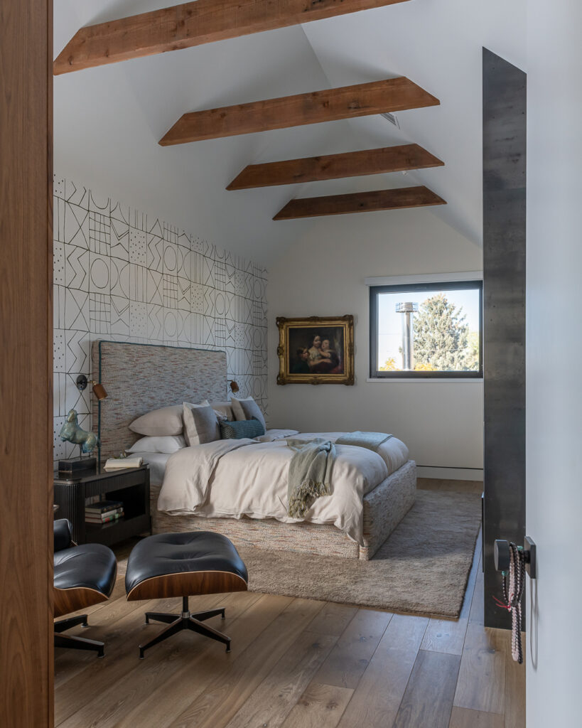 Primary Bedroom in Bozeman House by Envi Interior Design
