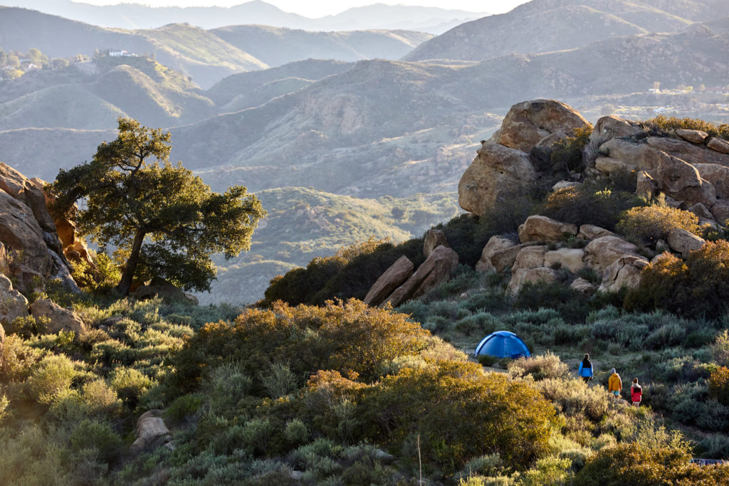 Cover Image with Campers and Tent