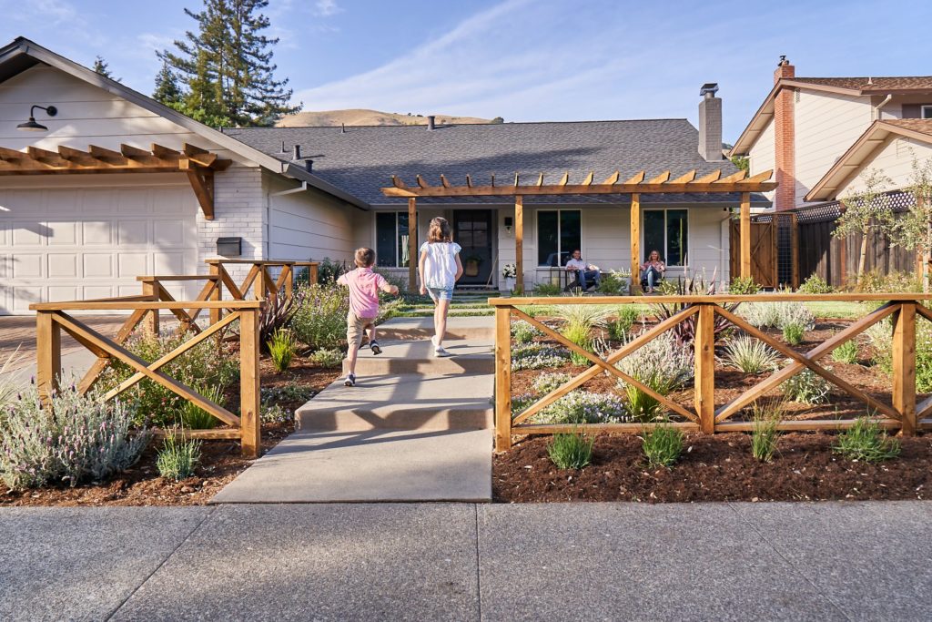 Children running infront of house