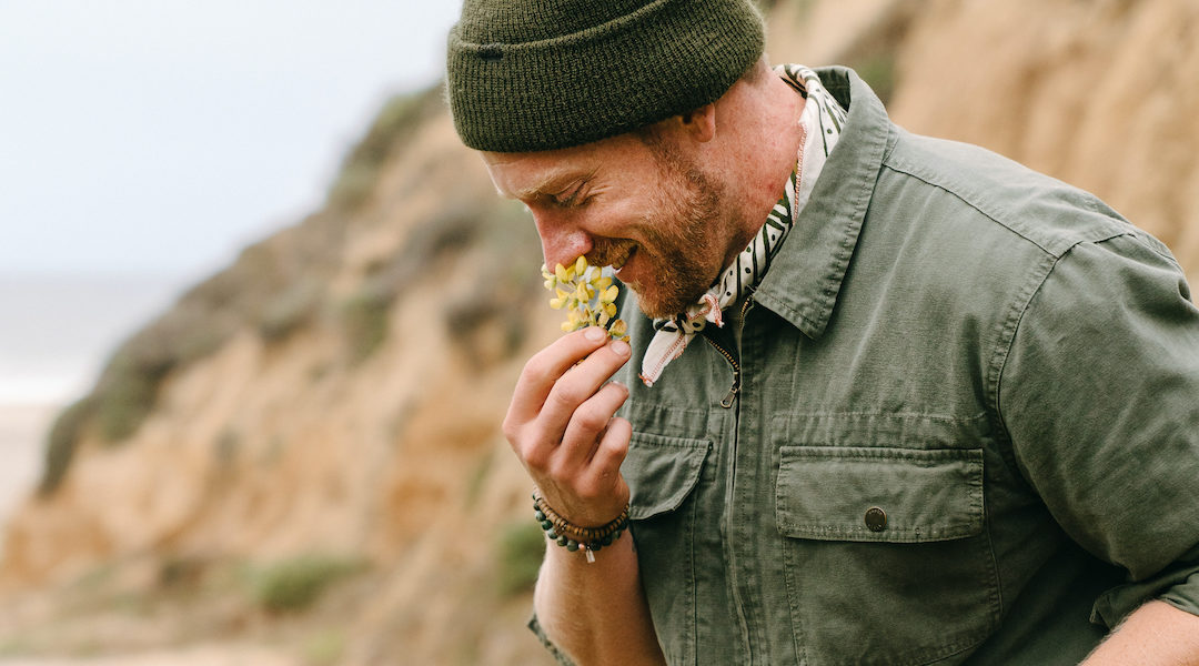 Chef Kevin O'Connor smelling fresh foraged herbs in California
