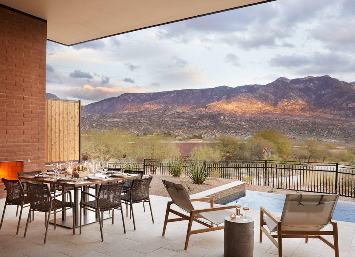 A patio with pool with the mountains in the background at Miraval Tucson, a great hotel for Thanksgiving couples getaways