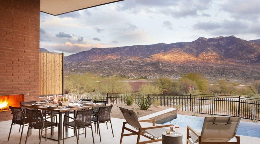 A patio with pool with the mountains in the background at Miraval Tucson, a great hotel for Thanksgiving couples getaways