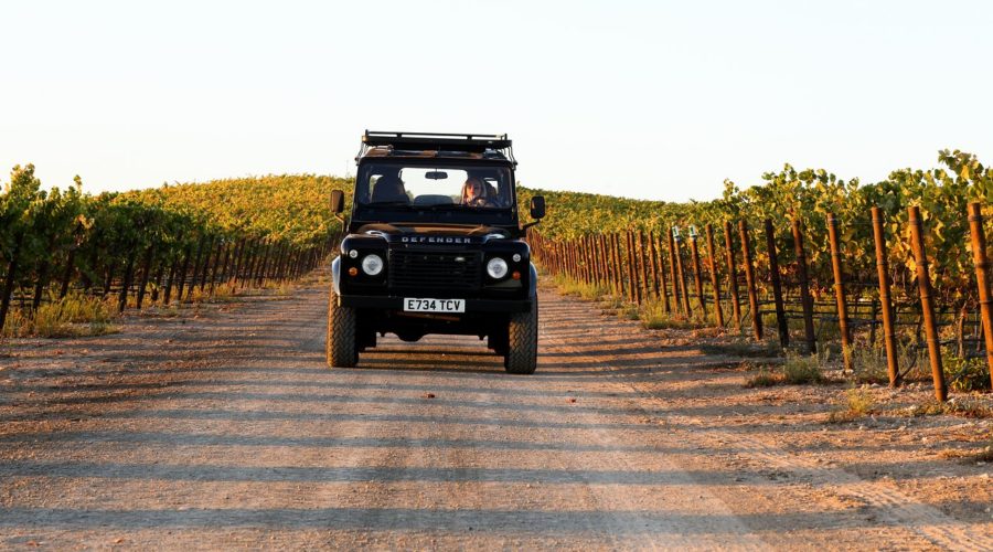 A Land Rover cruises through the vineyards in Napa on a California Wine Country tour