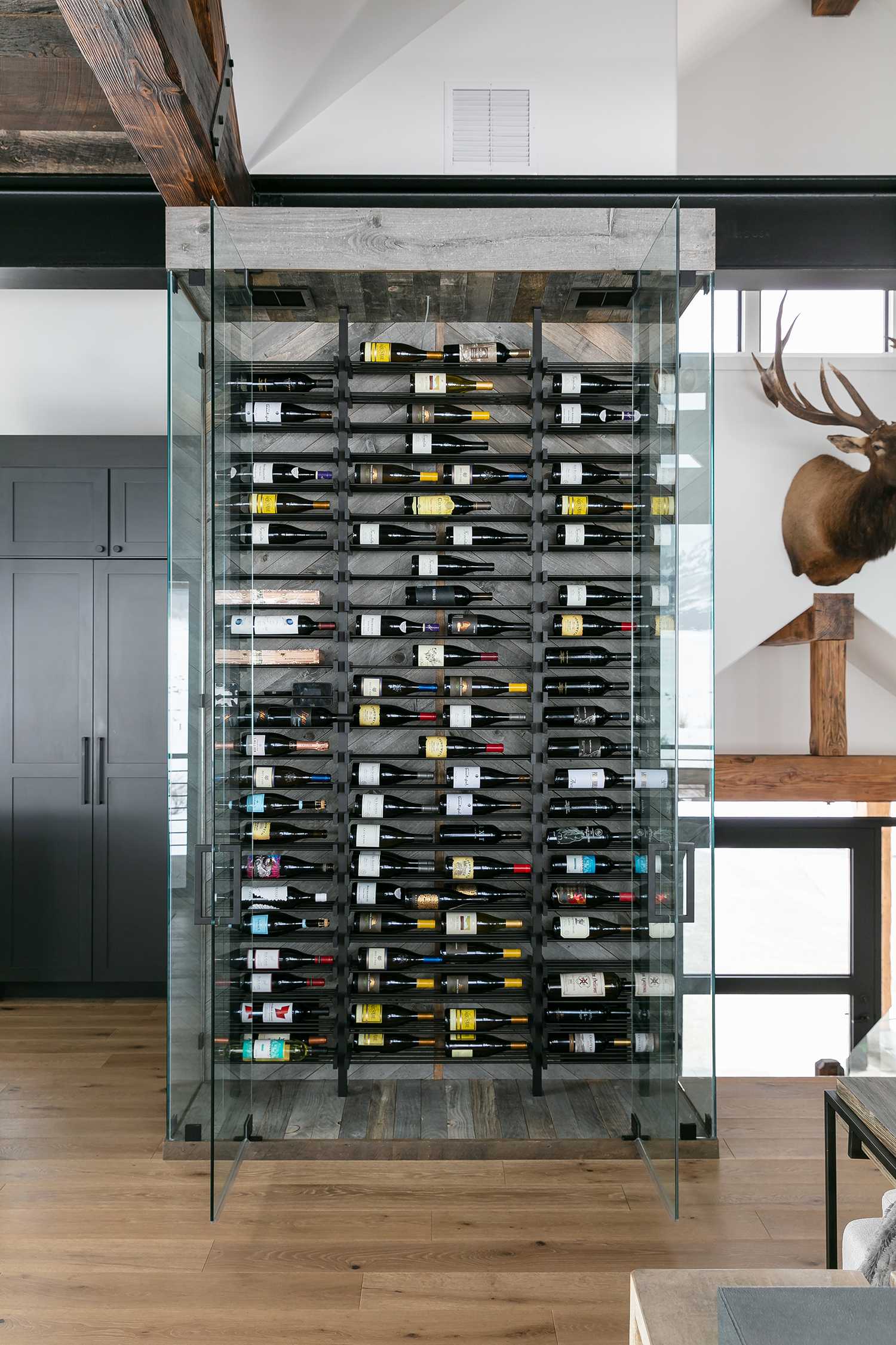 Wine Storage in Crested Butte House by Susie Ver Alvino