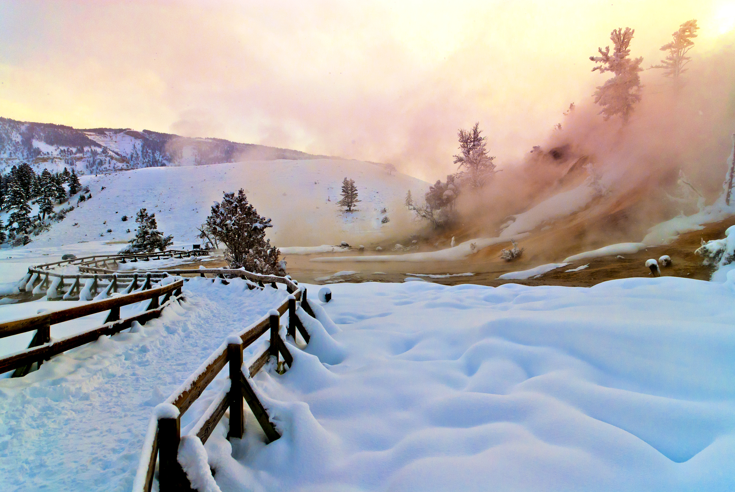 Mammoth Hot Springs area at sunset covered in snow at Yellowstone