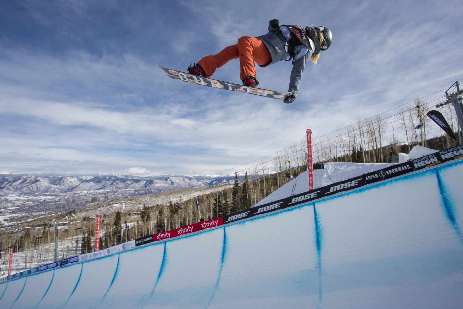 Man snowboarding on halfpipe in Aspen