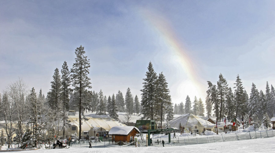 The base at Tamarack Resort with sports and cafe domes and a snow rainbow